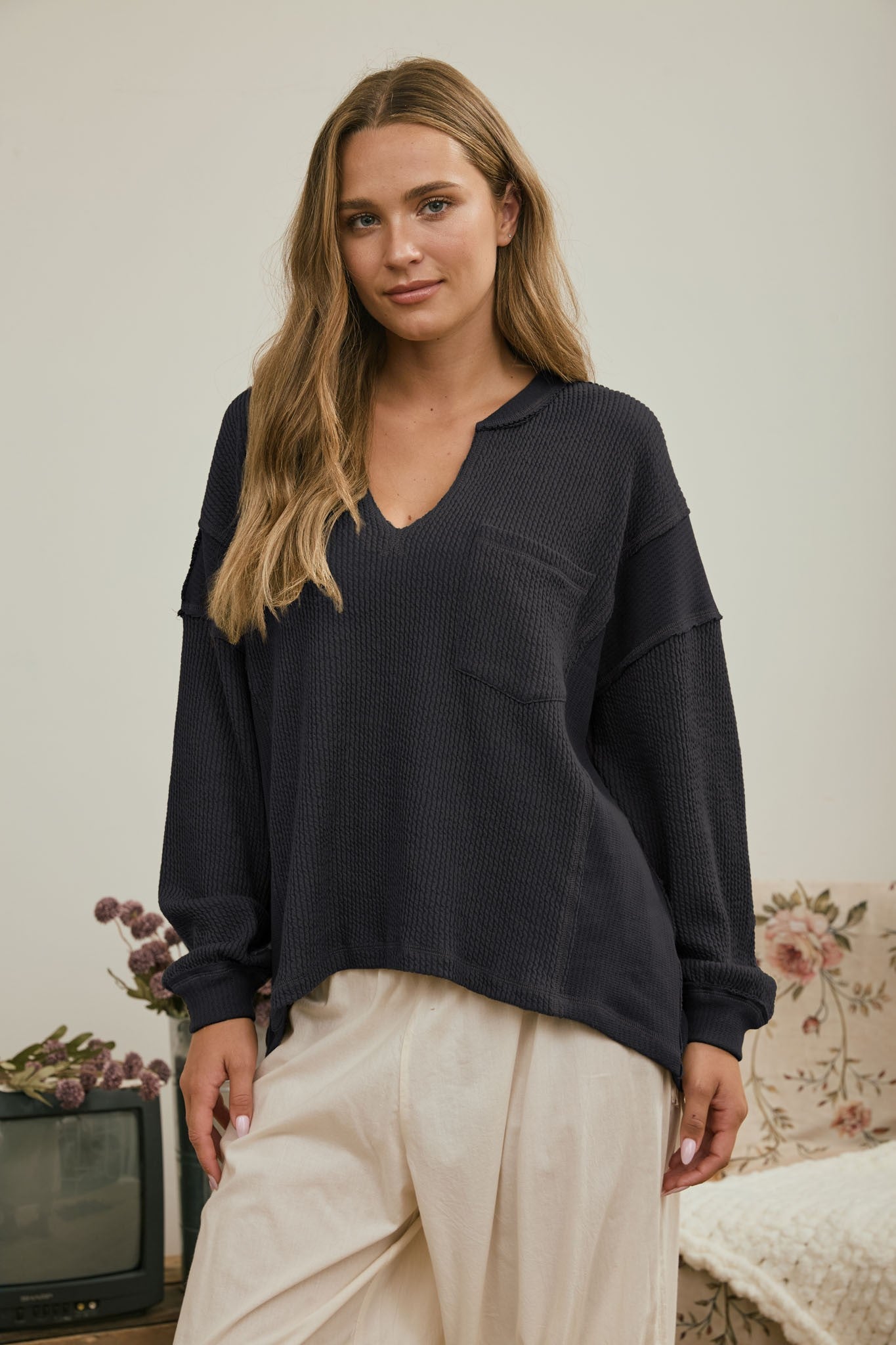 Split Neck Raw Edge Long Sleeve Ribbed Knit Top