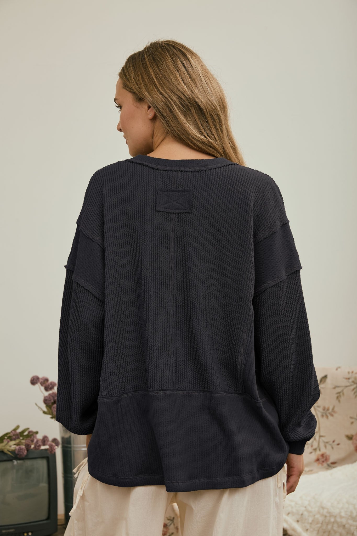 Split Neck Raw Edge Long Sleeve Ribbed Knit Top